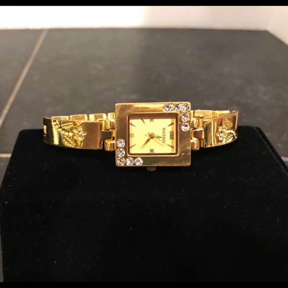 Pak Fook Goldstone watch w/floral-crystal accents. - Picture 3 of 8